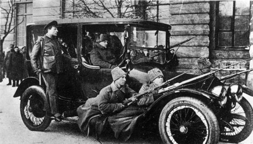 Armed revolutionary soldiers patrolling the streets of petrograd during the february bourgeois democratic revolution in 1917.