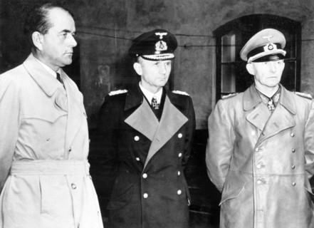 Albert speer (l), hitler's minister of production, grand admiral doenitz and general jodl, seen after their arrest in a courtyard at flemsburg, seat of doenitz government, 1945.