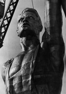 Worker figure being assembled out of stainless steel as part of a giant statue designed by v,i, mukhin also featuring a collective farm girl, the statue is being built for the soviet pavillion at the ...