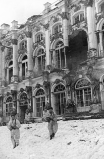 Soldiers in front of catherine palace in tsarskoye selo which has been severely damaged by the germans, january 1944.
