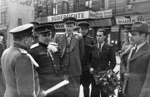 Colonel-general berzarin, soviet commandant of berlin (second from left) chatting with officials of the berlin subway after a ride on the underground railway, 1945 or 1946.