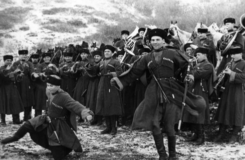 Soviet red army cossacks enjoying a little downtime by giving a traditional dance performance, february 1938.
