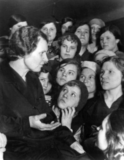 A group of workers at a moscow shoe factory listening to one of their members tell about the recent trial of members of the anti-soviet 'right-trotskyist bloc', convicted of betraying thier country, m...