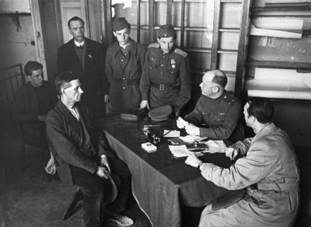 Lieutenant-colonel ugryumov, military commandant of the central district of berlin, receiving visitors, 1945 or 1946.