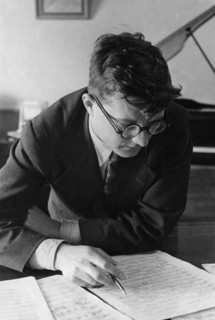 Soviet composer, dmitri shostakovich, working in his study, 1938.