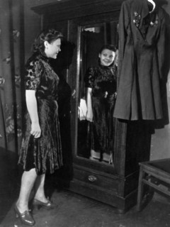 Nina lobkovskaya in war and peace, like all young girls, nina loves pretty clothes, here she is trying on a dress during a shopping trip, if it were not for her uniform with its decorations hanging ne...