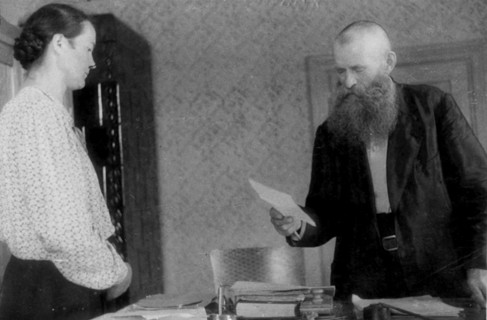 January, 1945, in poland, the agrarian reform has been carried out on the liberated polish territory, burgermeister of a village handing to a peasant the act granting the rights of possession of five ...