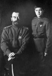 A portrait of tsar nicholas ll with his son alexei wearing military uniforms in 1915.
