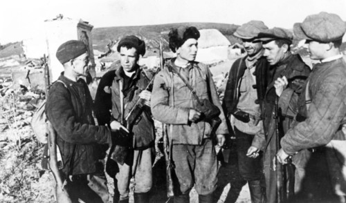 Guerrillas who returned to their native village liberated by the red army during world war ll.