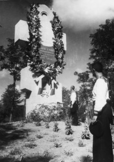 Soviet sailors paying their respects at the monument to russian soldiers killed during the defense of the russian fortress at port arthur in 1904 during the russo-japanese war, the picture was taken i...