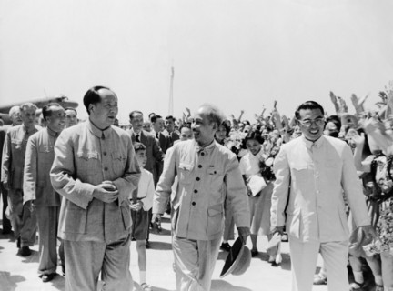 President ho chi minh of the democratic republic of vietnam being met at the airport by chairman mao zedong upon his arrival in peking (beijing), china on june 25, 1955.