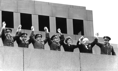 Soviet cosmonauts (left to right) dozovich, titov, andreyevich, gagarin, tereshkova, and bykovsky on lenin's tomb with nikita khrushchev, moscow, ussr, 1963.