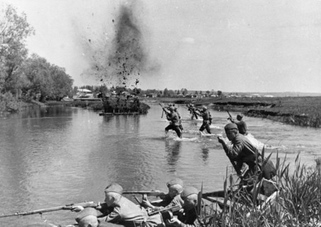 World war 2, soviet infantry crosing a river in ukraine under fire, 1943.