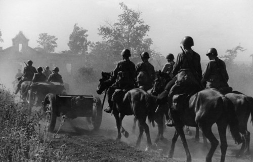 A horse-drawn artillery unit entering a village on the western bank of the don river, august 1942.