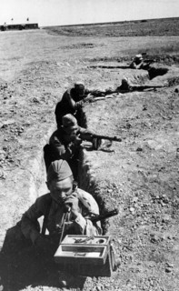 A soviet signalman in a trench in the don valley transmitting a dispatch to the forward edge of defense lines, august 1942.