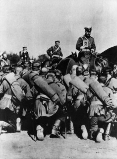Tsar nicholas ll, on horseback holding an icon, during prayers before a battle at the front in world war i.