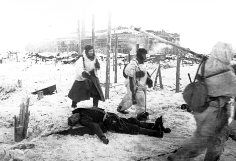 Stalingrad, december 1942, red army troops and dead german solider.