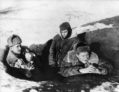 Walter ulbricht (left) and erich weinert (right) talk to german soldiers on the front line facing stalingrad during world war 2.