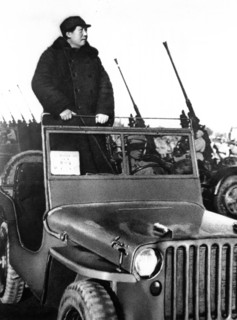 Chairman mao reviewing pla forces ay hsiyuan airfield on the outskirts of peking in march 1949.