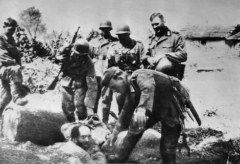 World war 2, german soldiers having fun tormenting a ukrainian jew, 1941, the photo was taken by a german soldier captured by the red army.