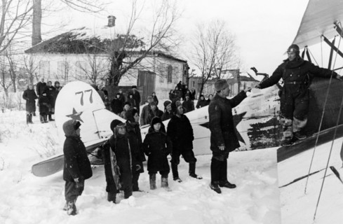 World war 2, a soviet polikarpov po-2 (u-2) plane in liberated byelgorod in february 1943, the people are giving the pilot letters to relatives to mail.