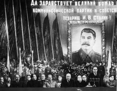 Ceremony at the bolshoi theater celebrating joseph stalin's 70th birthday, seated, from left to right, are  togliatti, budenni, kaganovich, suslov, mao tse-tung (zedong), bulganin, stalin, vassilevsky...
