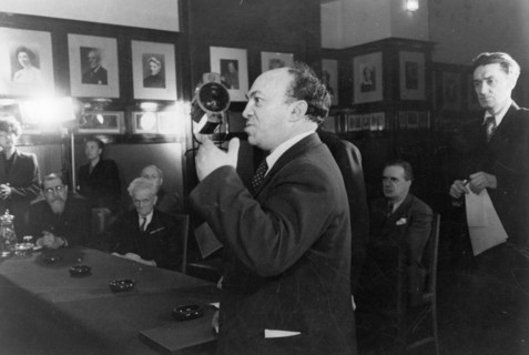 A special meeting of the stalin prize committee held at the moscow art theater where badges and diplomas were being presented to the soviet artists and writers who had been awarded stalin prizes for o...