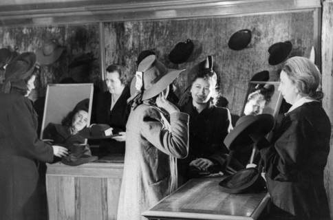 Women trying on hats at a millinery in moscow, april 1948.