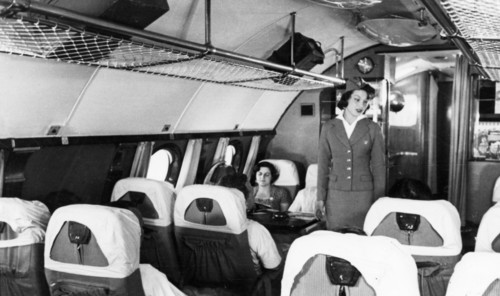 A stewardess and passengers aboard a tu-114 airliner (at the time, the world's largest), 1959.