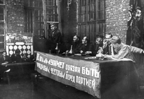 Comrade solovyov, the secretary of the communist party branch at the krasny putilovets plant, undergoing questioning duing the campaign to cleanse the cp of hostile elements, leningrad, 1933, the bann...