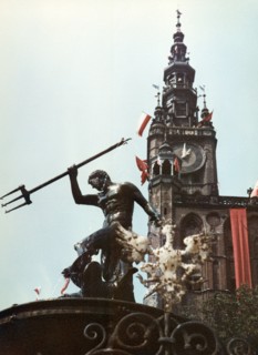 Neptune fountain and the city hall clock tower in gdansk, poland, 1965.