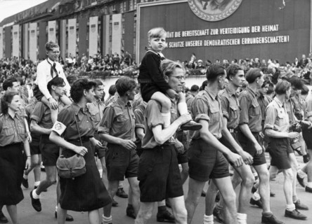 Free german youth marching before the reviewing stand during the parliament of free german youth in leipzig, june 1, 1952.
