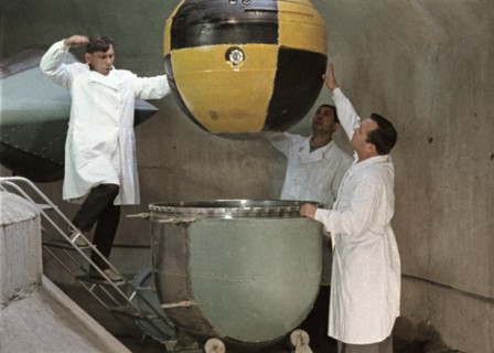 The descent capsule of soviet space probe venera 5 or 6 being lowered into a centrifuge for testing, this is a still from the film 'the storming of venus', produced by e, kuzis at the tsentrnauchfilm ...