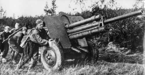 A soviet gun is pushed to its firing position outside rzhev in 1942.