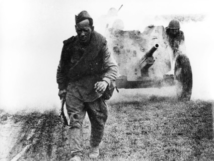 A soviet soldier walking in the battlefield, 1944.