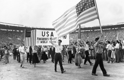 Sixth world festival of youth and students in moscow, delegation from the usa marching during the grand opening ceremonies at the lenin central stadium, july 28, 1957.