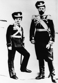 A portrait of tsar nicholas ll with his son alexei wearing military uniforms.