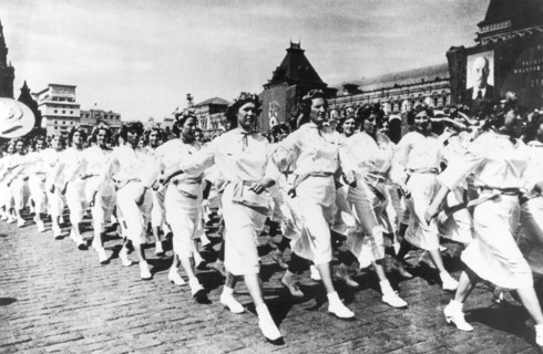 Ukrainian sportswomen participate in a sports parade in red square, moscow, ussr, 1930s.