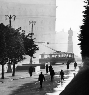 An early morning street scene at dzerzhinsky square in moscow, august 1959, kgb headquarters, lubyanka, is in the background.
