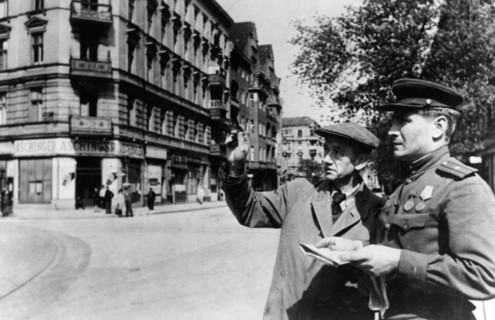 Commandant of a section of a section of the schoeneberg district of berlin, major grobov, accompanied by a representative of the burgermeister erich kobyliatski, inspecting the district, june 1945.