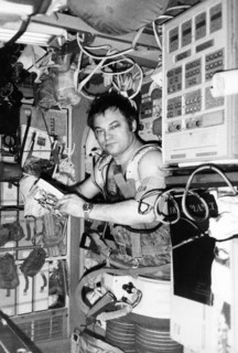 Soviet cosmonaut yuri romanenko wearing the chibis vacuum suit aboard the mir orbital space station, soyuz tm-2, 1987.