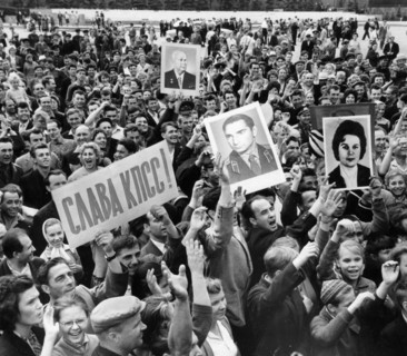 Moscow residents cheering the news of a successful launch of vostok 5 space craft, piloted by soviet woman cosmonaut valentina tereshkova, the picture was taken 5 minutes after the official tass annou...