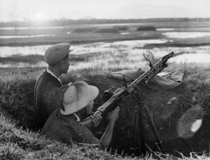 Ant-aircraft machine gunner guarding the skies over the town of vinh, north vietnam, 1965.