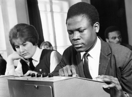 Anna golosok from bryansk and ovuar samuel from kenya in the technical means study room of the order of the red banner of labor technical school of the korinsk state farm in the bryansk oblast, may 19...