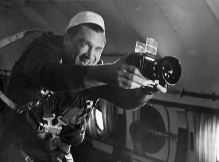 Cosmonaut anatoly filipchenko, commander of soviet space mission soyuz 7, in weightless training, with a camera, ussr, 1969.