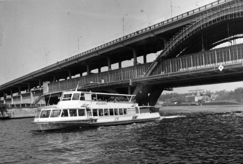 Moscow, ussr may 1972, a motorship on the moskva river passing under the metro bridge at lenin hills.