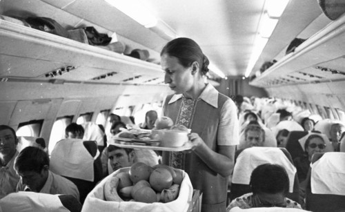 Pasengers being served during an aeroflot flight to tokyo, september 1973.