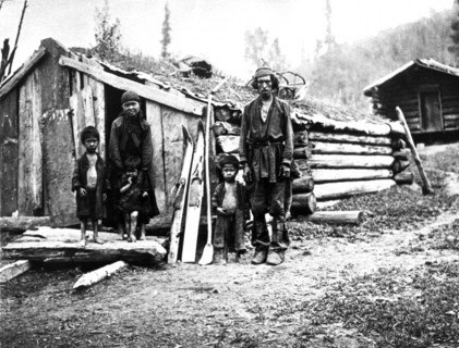 Gorno-altai region, siberia, russia, 1912, a peasant family outside their one room log hut (izba).