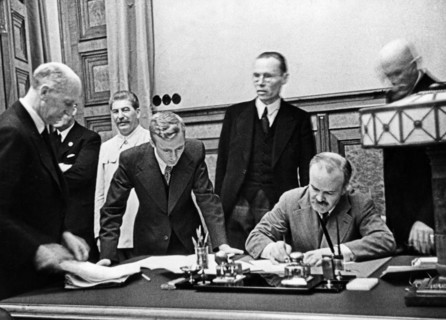 Vyacheslav molotov, chairman of the people's commissars' council and people's commissar for foreign affairs, signing of the treaty of non-aggression between germany and the union of soviet socialist r...