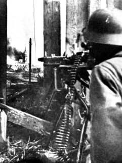 Ussr, novgorod region, a german machine-gunner points at staraya russa city.